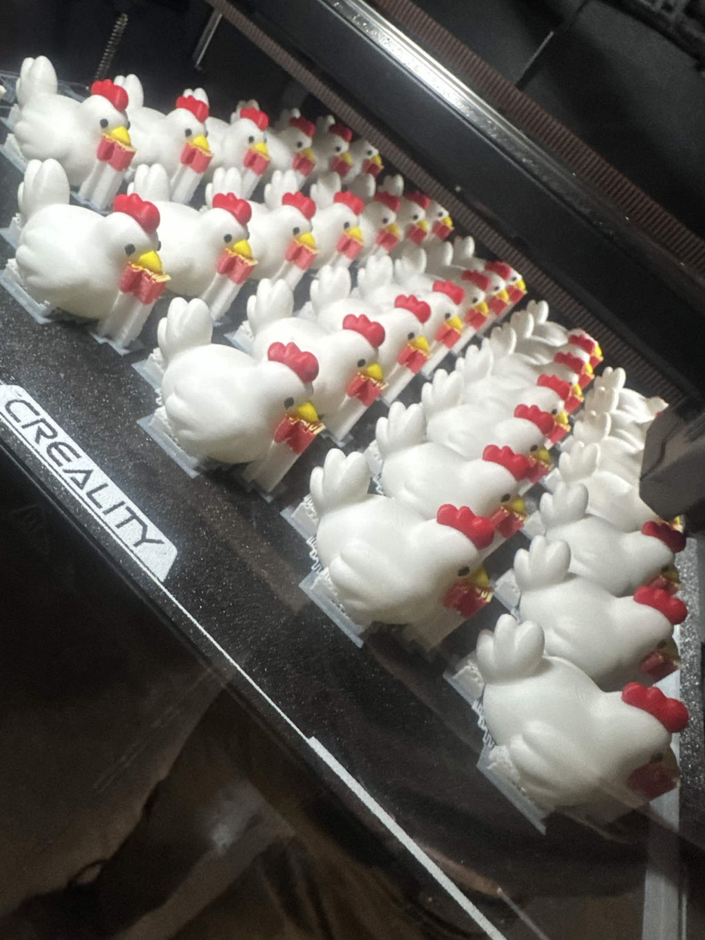 Rows of multicolor Rapid Roost chickens fresh off the printer